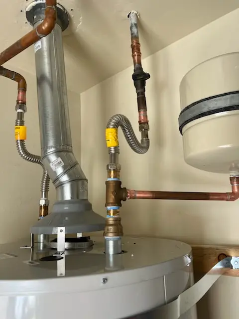 Water heater installation and plumbing repair in Carriagehouse